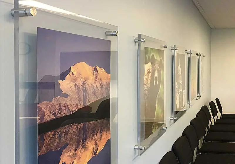 Frameless Acrylic Poster Displays Mounted on Standoffs